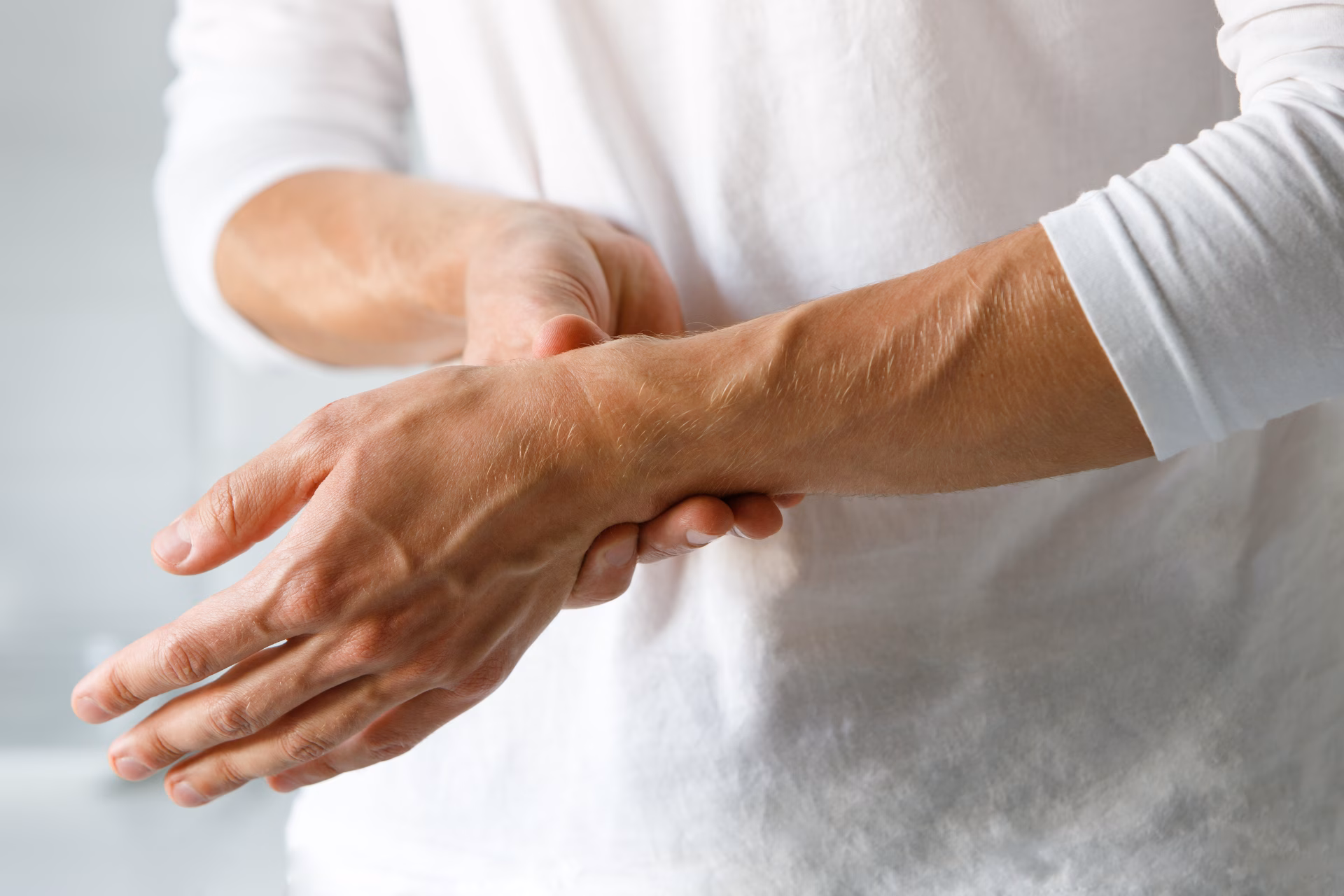 closeup of man arms holding painful wrist caused b 2025 03 08 12 02 55 utc converted